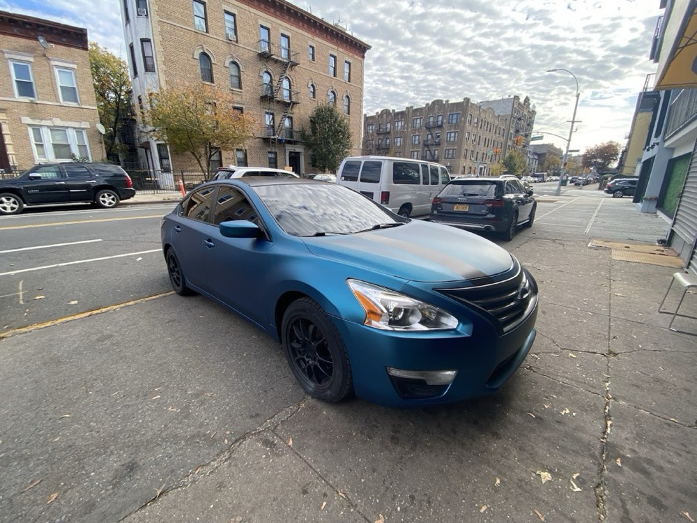 Nissan Altima in satin blue wrap with blacked-out trim