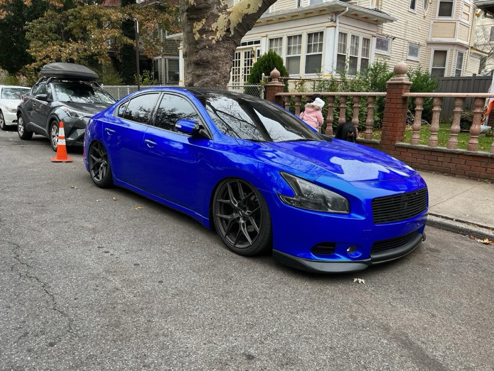 Nissan Maxima in gloss blue wrap on black wheels